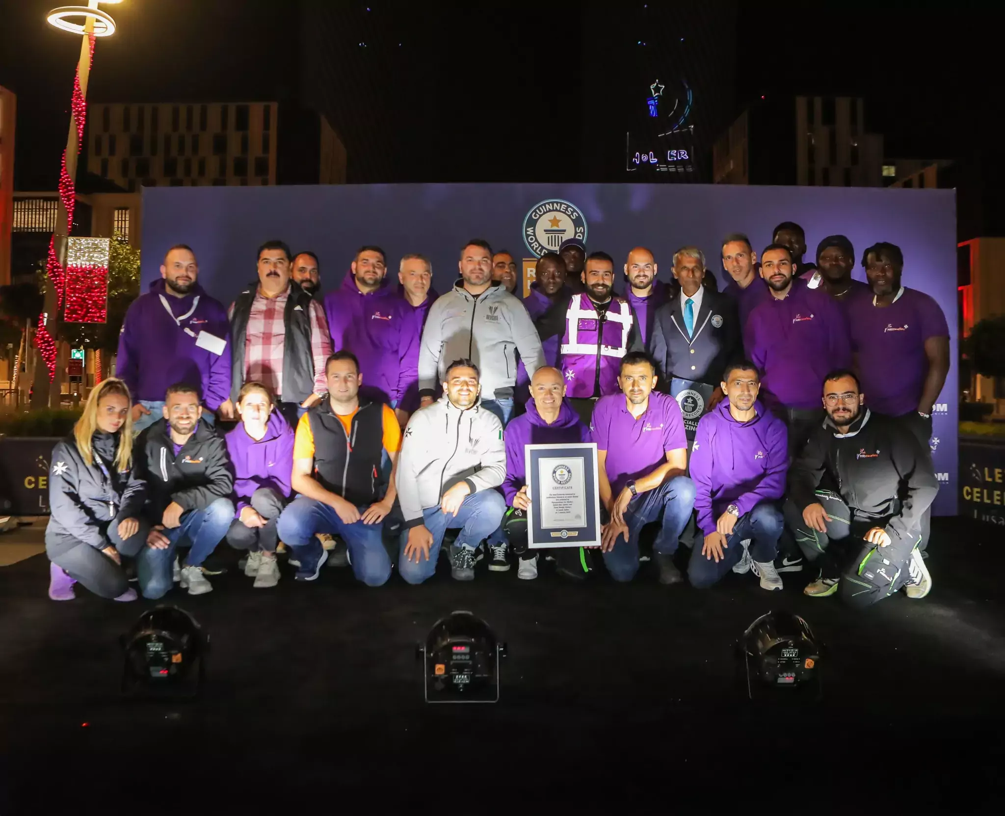 Pyroemotions team celebrating the Guinness World Record for the most fireworks launched by drones in an aerial display