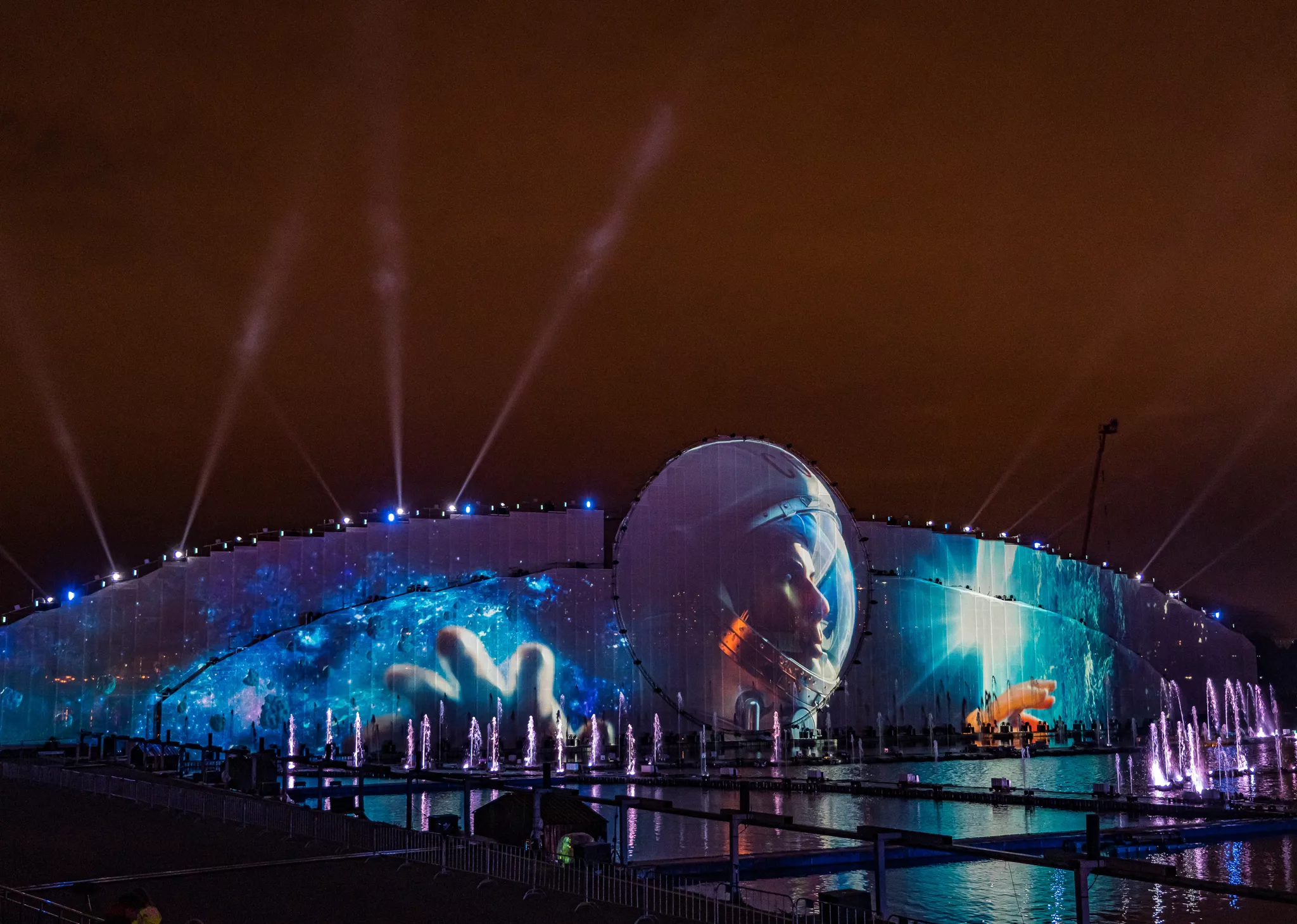 Projecting on buildings or vertical surfaces creates engaging zones for large multimedia events