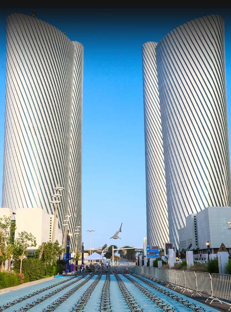 Drones lined up between tall buildings for a spectacular show