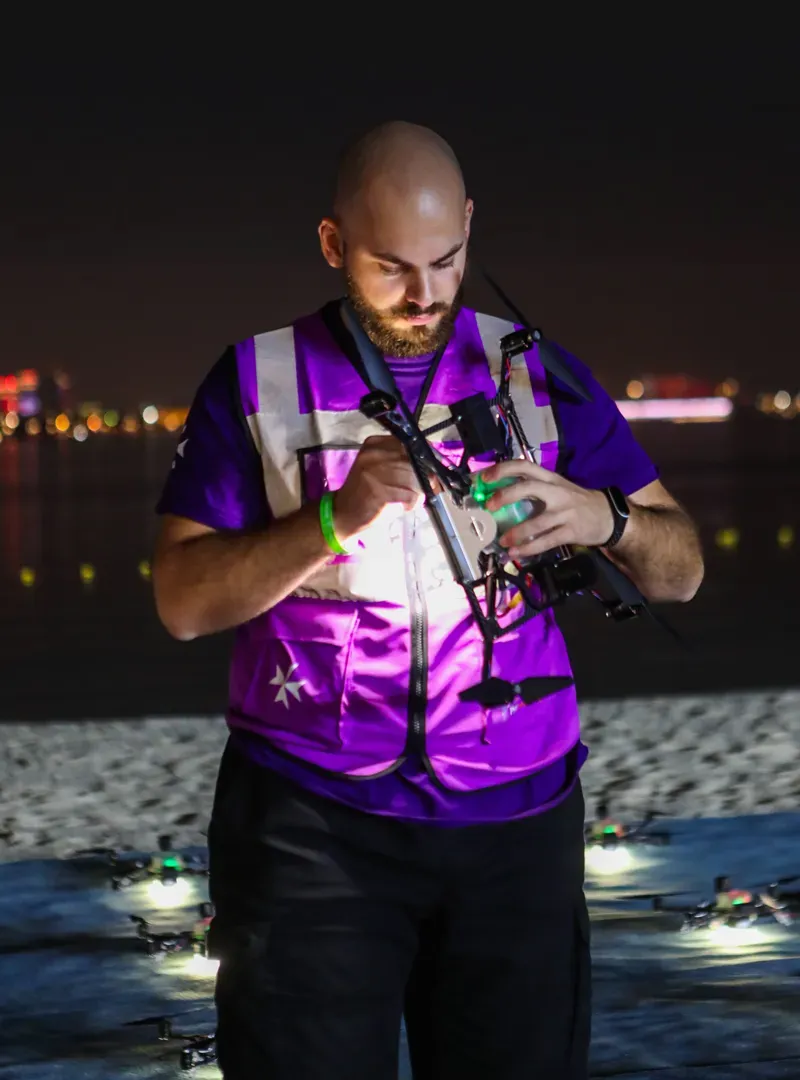 Technician inspecting a pyrotechnic drone before the show