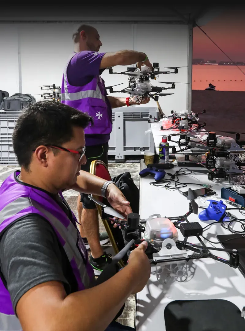 Technicians working on drones before the show